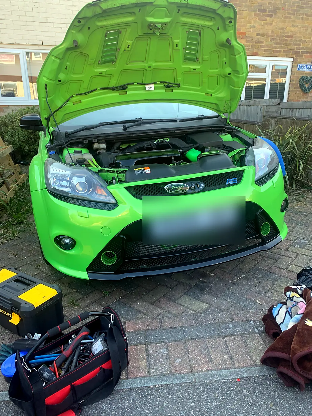 Kent Mobile AutoCare working on a Ford Focus RS on a customer's driveway