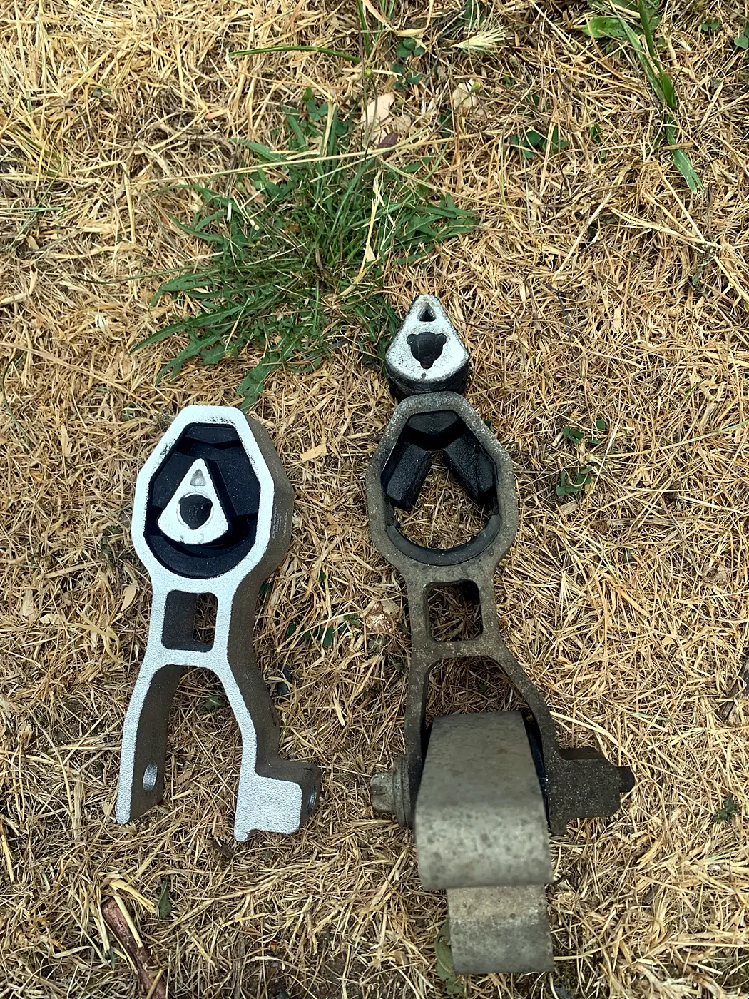 Worn engine mount (right) replaced with a new one (left).